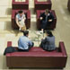 Four Centrica employees sitting in an office atrium, shot from above.